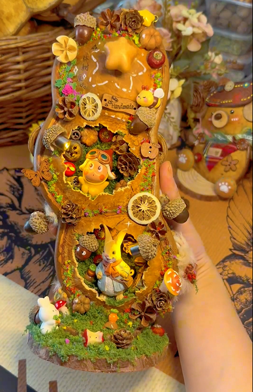 Handmade light-up woodland story tower decor with glowing miniature forest scenes