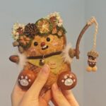 Detailed front view of Open-Mouth Pod Doll – Acorn Fishing Cub featuring floral crown and forest-inspired styling