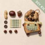 DIY kit materials for Open-Mouth Pod Doll Plaid Pocket Puppy arranged beside the finished design on a neutral background