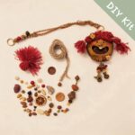DIY kit materials for Open-Mouth Pod Doll Berry Tassel Sprite arranged beside the finished design on a neutral background