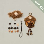 DIY kit materials for Open-Mouth Pod Doll Walnut Shell Sprite arranged beside the finished design on a neutral background