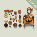 DIY kit materials for Open-Mouth Pod Doll Pumpkin Whisker Kitty arranged on a neutral background beside the finished design