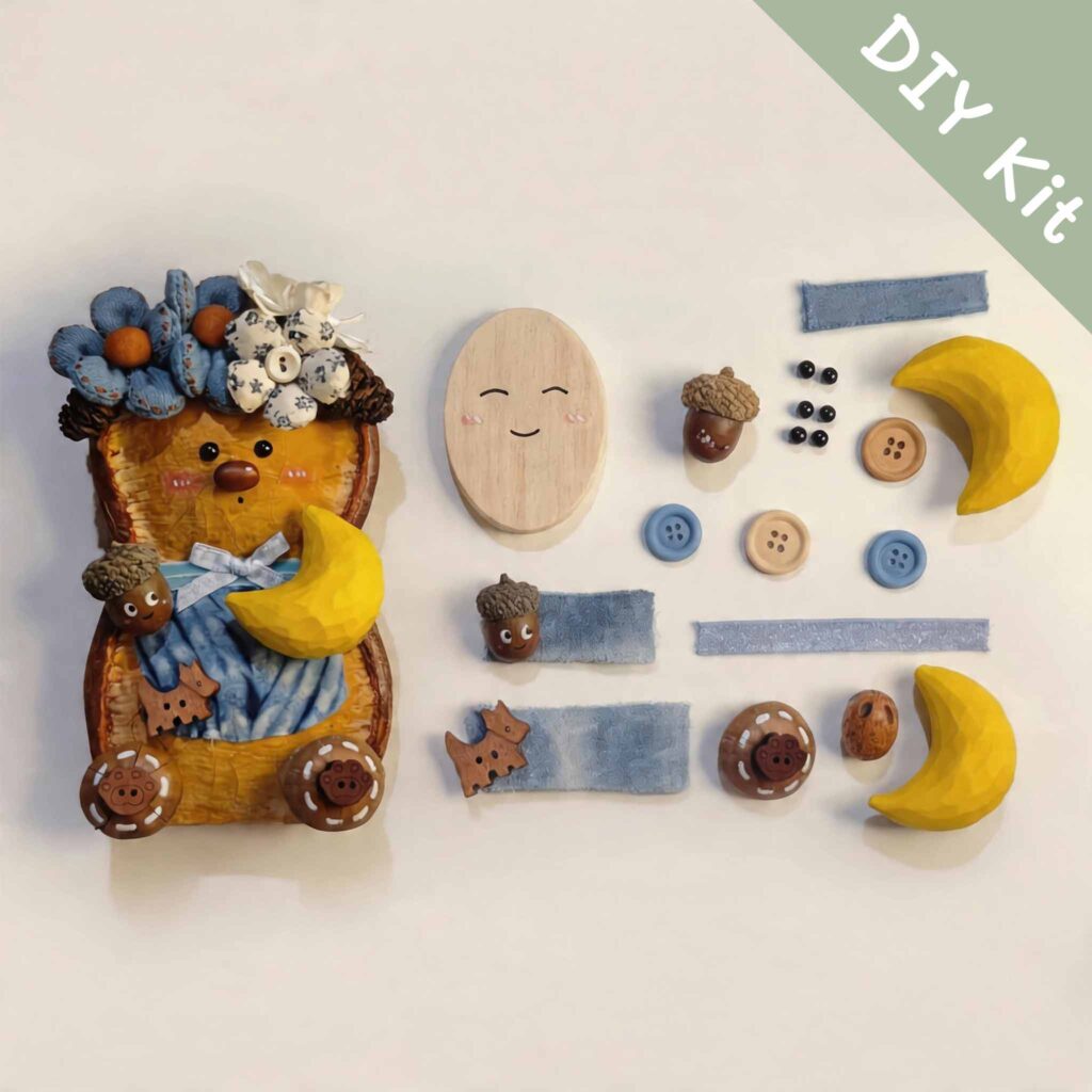Moonlit Blue Blossom Bear pod doll DIY kit with blue flowers, crescent moon, acorn details, and handmade parts laid flat