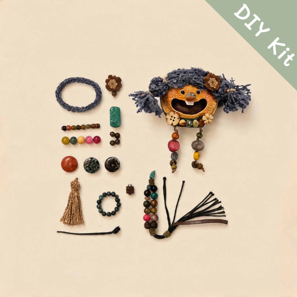 Flat lay of a DIY kit featuring a blue pigtail open-mouth pod doll charm with colorful beads and handmade accessories