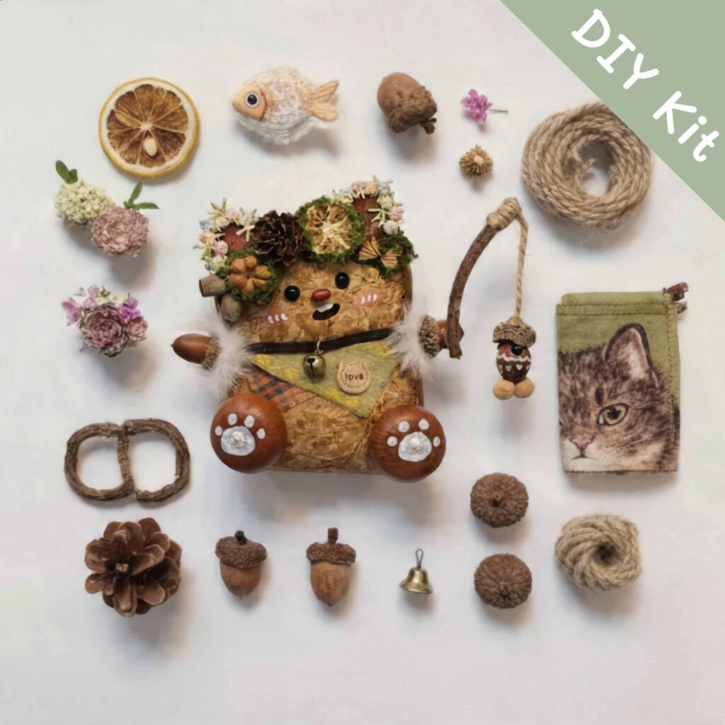 Flat lay of a DIY kit for a handmade open-mouth woodland fishing pod doll with natural materials and tiny accessories