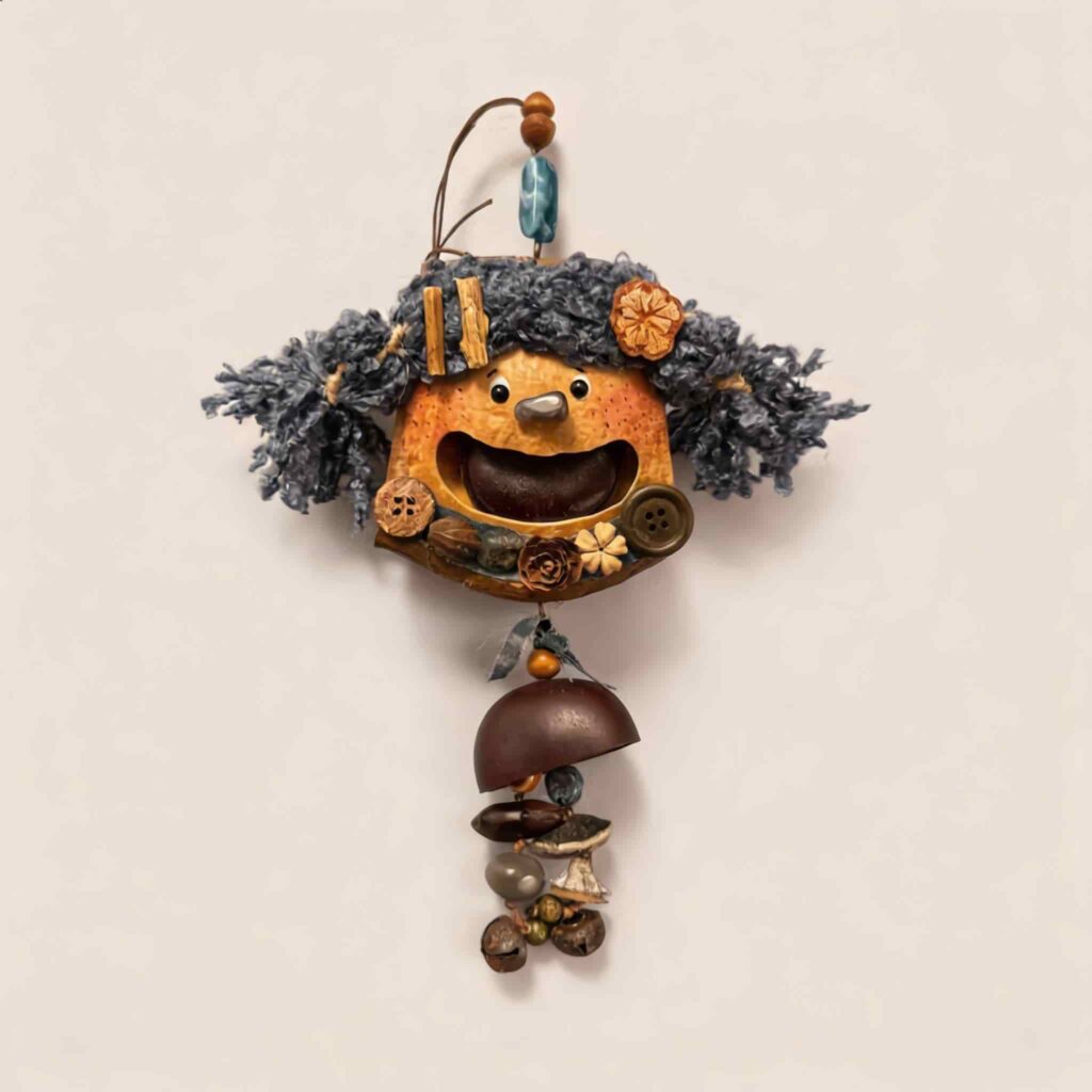 Open-Mouth Pod Doll Charm Midnight Chime with deep blue yarn pigtails and dangling chime-inspired drop on a neutral background