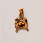 Open-Mouth Pod Doll Pumpkin Whisker Kitty with cat-shaped silhouette, whisker details, and dangling paw charms on a neutral background