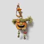 Open-Mouth Pod Doll Mossy Tassel Gremlin with mossy green tassel pigtails and dangling woodland strands on a neutral background