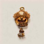 Front view of Walnut Shell Sprite handmade pod doll charm with joyful wide smile and soft curly woodland styling
