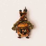 Reverse view of Mossy Witch Cottage Twin pod doll with stitched smile, round glasses, and rustic witch-inspired details
