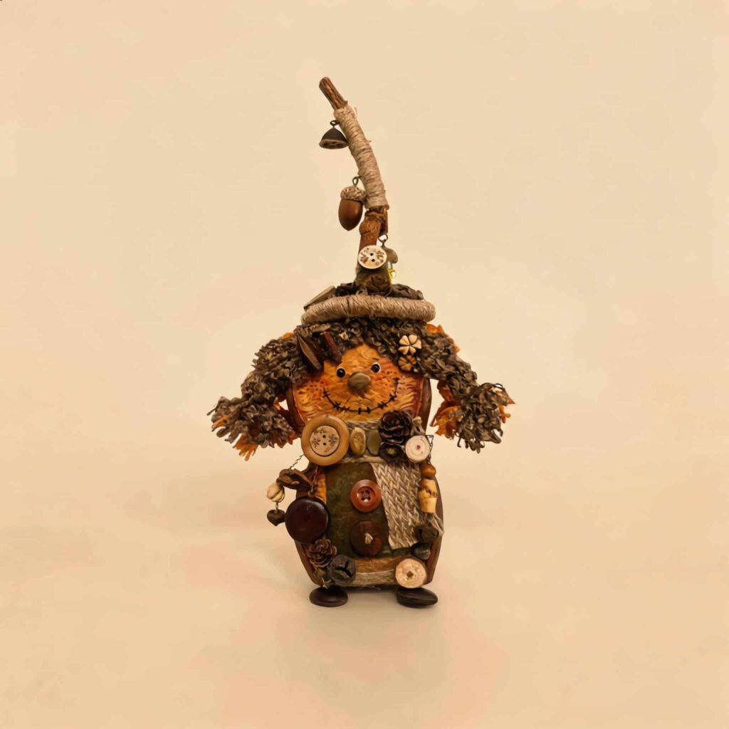 Reverse view of Woodland Witch Twin pod doll with stitched smile, earthy patchwork details, and rustic handmade styling