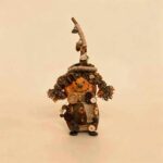 Reverse view of Woodland Witch Twin pod doll with stitched smile, earthy patchwork details, and rustic handmade styling