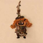 Double-Sided Pod Doll Woodland Witch Twin with bright orange pigtails, tiny glasses, and tall rustic witch hat on a neutral background