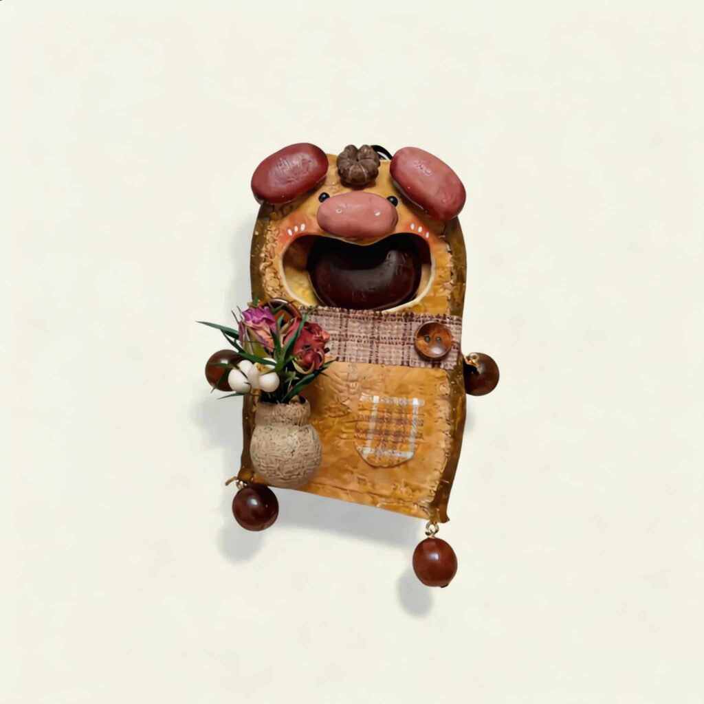 Closed-face view of Bloom Vase Edition pig pod doll with blush detail, rounded ears, and rustic handmade styling