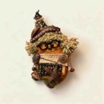 Pod Doll Mossy Star Scholar with moss-green textured hair, round black glasses, woodland-style hat, and dangling star charm on a neutral background