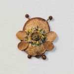 Reverse view of Blossom Bee Fairy pod doll with layered petal design and dimensional floral centerpiece