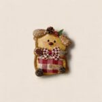 Handmade Red Plaid Acorn Puppy pod doll with floppy seed pod ears, red plaid pocket, woodland bow tie, and acorn accent