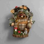 Front view of Mossy Mushroom Granny pod doll with patchwork scarf, tiny pouch, mushrooms, moss, and forest base decor