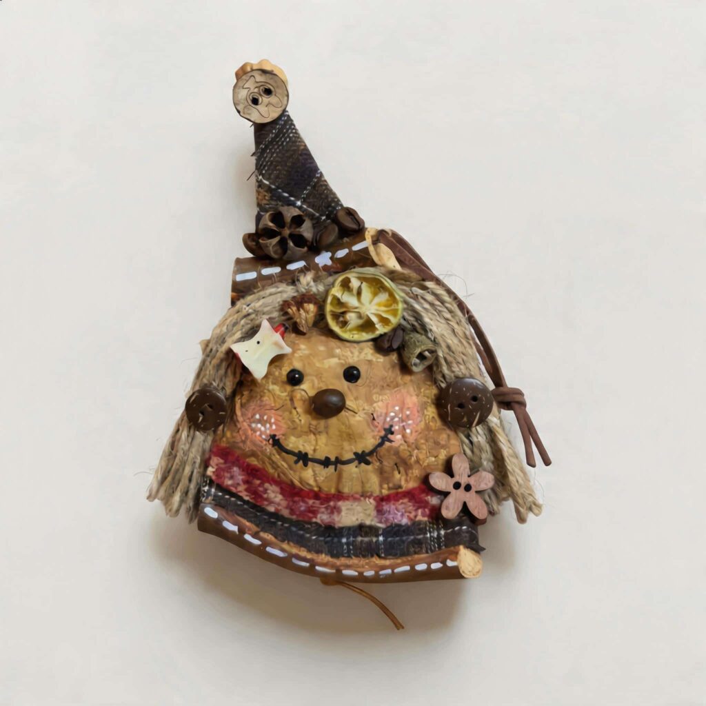 Rustic witch-inspired handmade pod doll isolated on light background