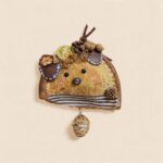 Front display of Citrus Walnut Mouse Pod Doll with dried citrus detail and round stitched ears