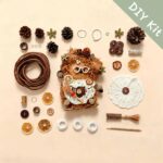 Hearthkeeper Bear Pod Doll DIY kit flat lay with materials lace apron broom citrus slices and accessories