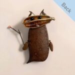 Double-Sided Pod Doll Twig Blossom Sprite back view with open-mouth expression and tiny horn-like details