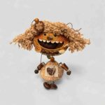 Front view of Hazel Giggle handmade pod doll charm with dangling lower charm section and soft woodland details