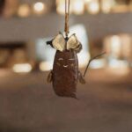 Handmade double-sided peace bean doll ornament with front and back character expressions