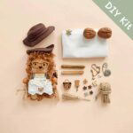 DIY Kit for Pod Doll laid out, showing seed-pod parts, accessories, and packaging.