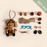 DIY Kit for Open-Mouth Pod Doll – Glasses Bear laid out with materials