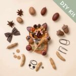 DIY Kit for Pod Doll – Orange Flower Cat showing seed pods and accessories