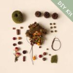 DIY Kit for Pod Doll – Pinecone Crown Moss Creature, showing moss, seed pods, beads