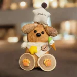 Finished Pod Doll – Brown Dog wearing a knit hat and seed-pod body.
