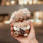 Finished Pod Doll with peach curly seed-pod hair