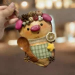 Finished Pod Doll image showing Pink-Nosed Forest Friend with seed pod crown