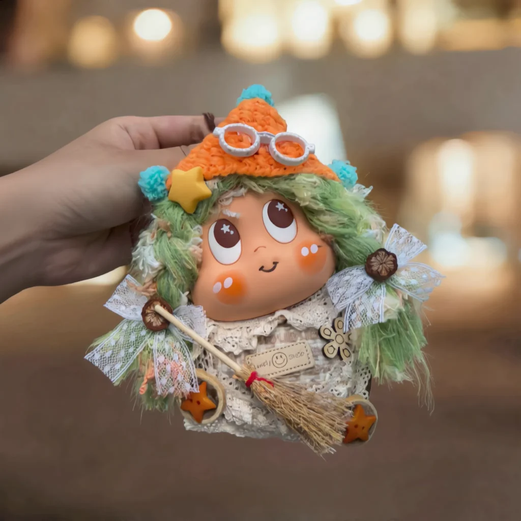 Finished Pod Doll with orange knit hat, white round glasses, and turquoise accents