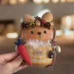 Finished Pod Doll with seed-pod crown featuring pinecones and flowers