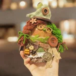 Finished Pod Doll with patchwork green hat and button eye