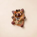 Detail shot of the finished Pod Doll – Orange Flower Cat