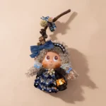 Detail view of the finished Pod Doll's face and seed-pod embellishments