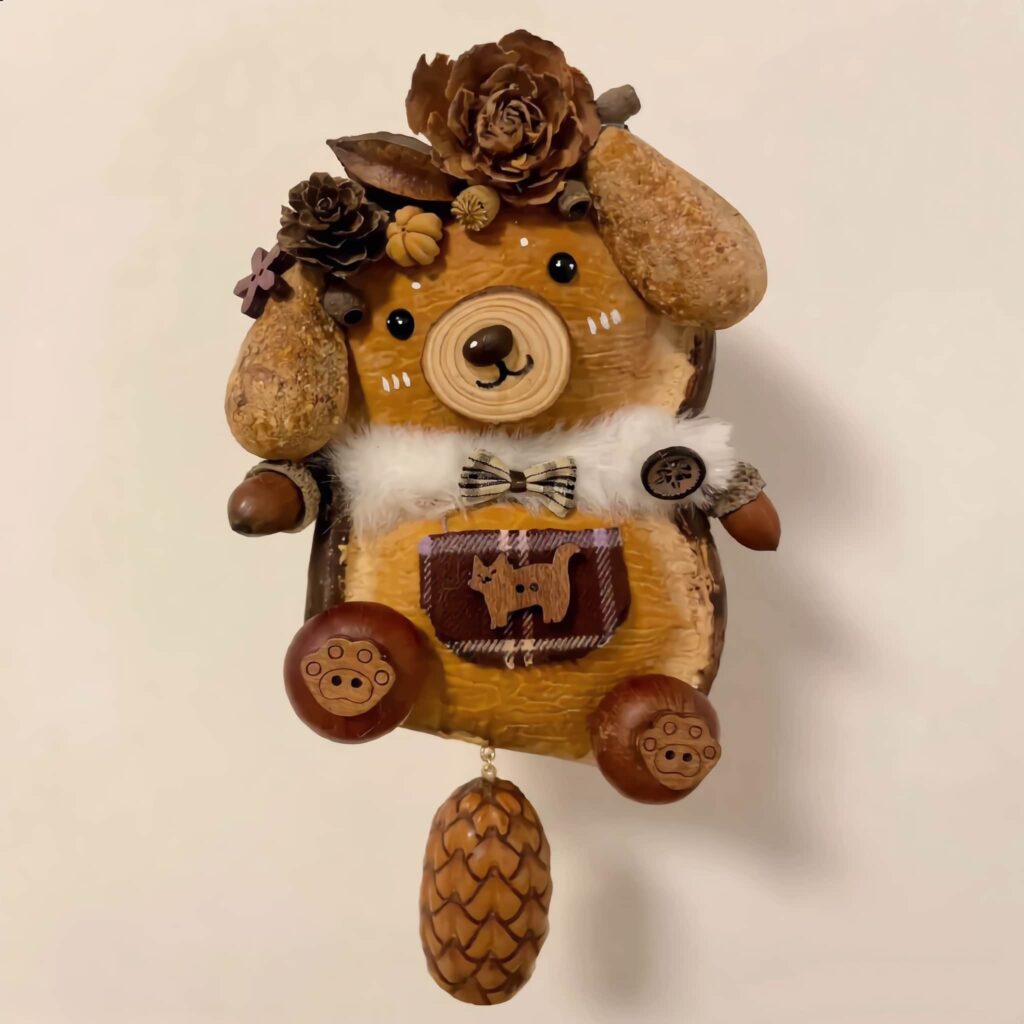 Close-up of Woodland Bear finished doll detailing pinecones and seed pods