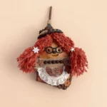 Detail shot of Pod Doll face with glasses