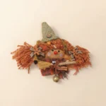 Close-up view of hat and face on Pod Doll – Autumn Scarecrow