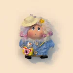 Close-up of pod doll's face and hat, detail shot