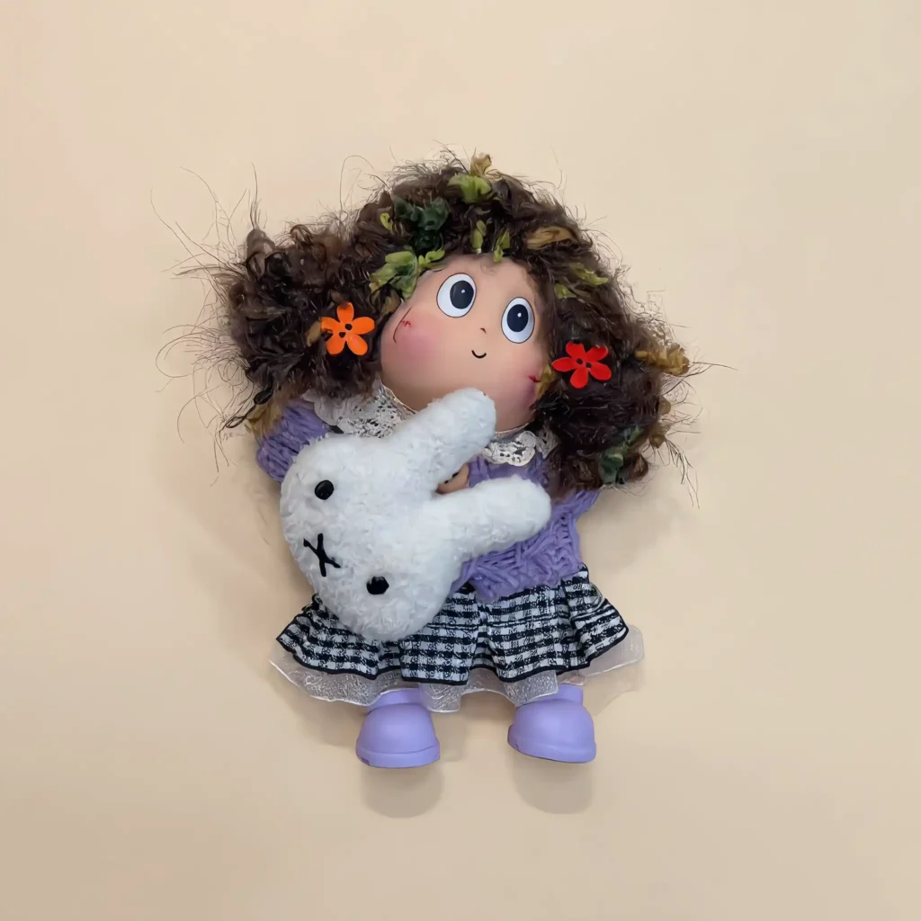 Detail of Pod Doll's face and hair with crown