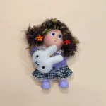 Detail of Pod Doll's face and hair with crown
