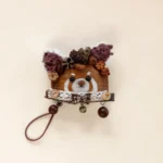 Detail shot of Pod Doll Bear-Faced Pinecone Crown