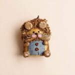 Detail shot of the Curly-Mane Lion Pod Doll's face and texture