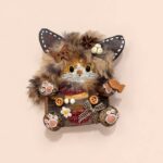 Close-up of Pod Doll's face and accessories, showing fur texture and butterfly on ear