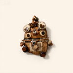 Detailed view of the Pod Doll showing close-up button-eye discs